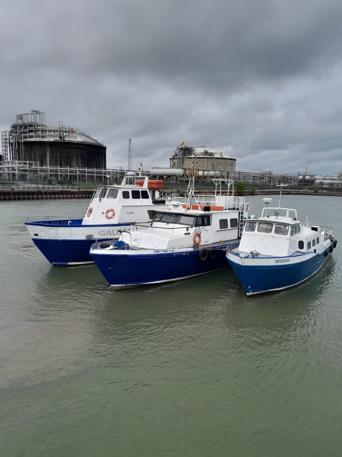 Three Crew Movers marine launch vessels at the waterfront